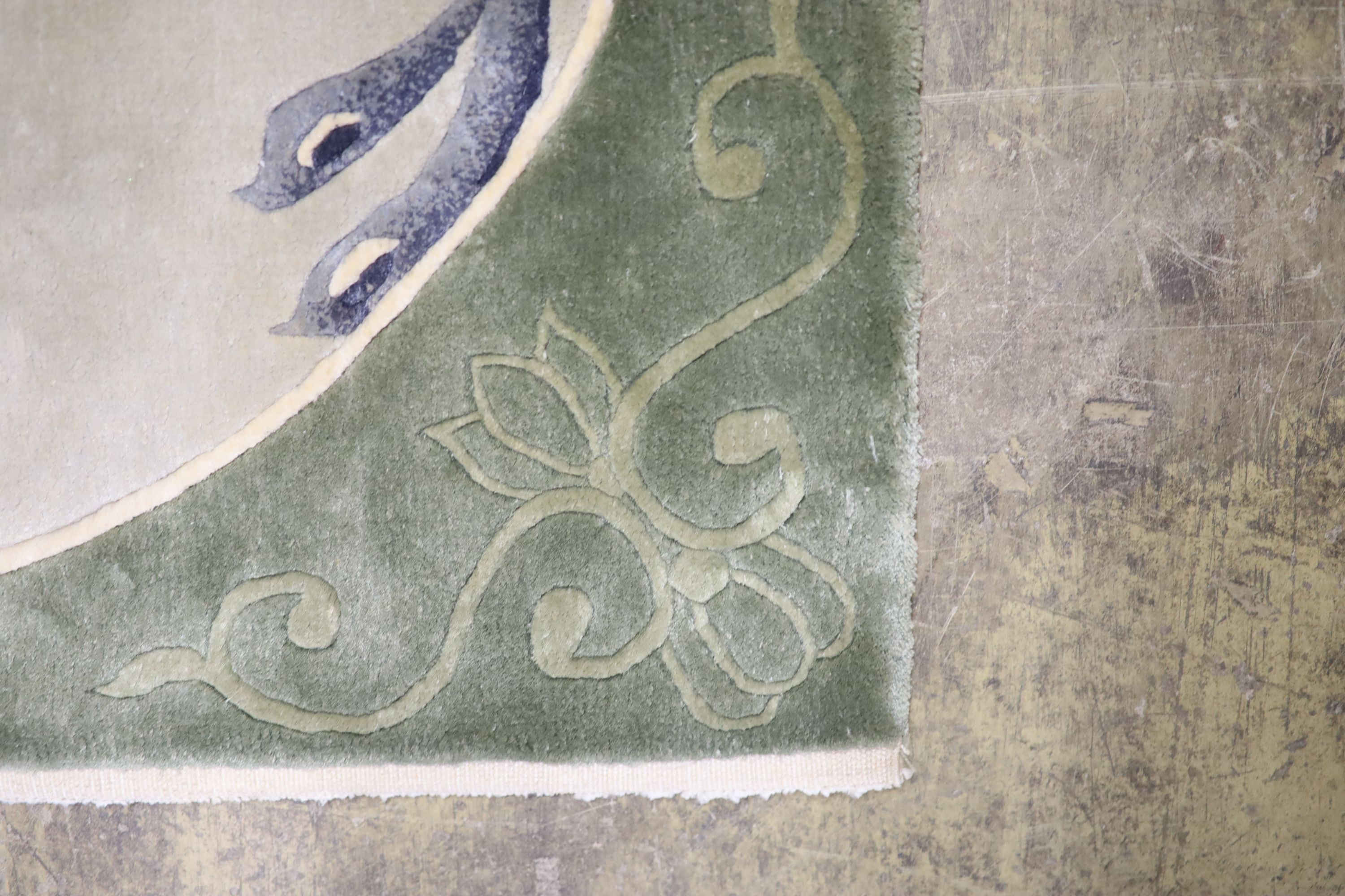 A Chinese washed and embossed panel depicting birds amongst prunus and cherries